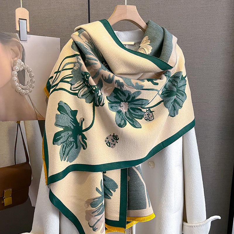 Floral patterned scarf draped over a mannequin with a handbag in the background.
