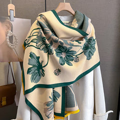 Floral patterned scarf draped over a mannequin with a handbag in the background.